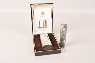 Lot 560 - Two white metal Dunhill Pocket Lighters