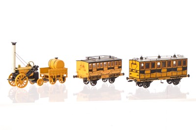 Lot 590 - 00 Gauge scratchbuilt on Airfix Tanker chassis LMR  coach 'Traveller', Tri-ang Coach 'Times' converted to EM and Matchbox static Stephenson's Rocket and Tender (4)