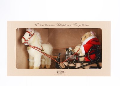 Lot 101 - A Steiff limited edition Father Christmas teddy bear with pony sledge