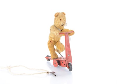 Lot 168 - A post-war Fewo clockwork teddy bear on scooter