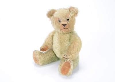 Lot 183 - A 1920/30s green mohair muscial teddy bear
