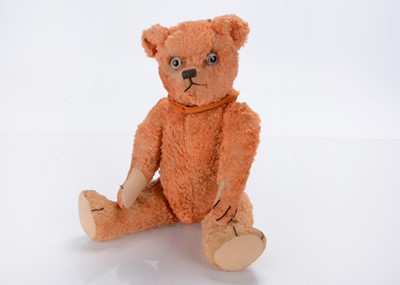 Lot 298 - A 1930s Omega (British United Toy Manufacturing Co. Ltd) orange art silk teddy bear