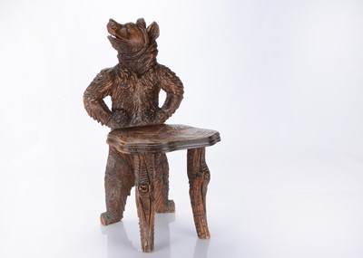 Lot 322 - A late 19th Century Black Forest carved wooden bear child's chair