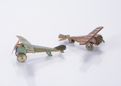 Lot 394 - Two Japanese Penny Toy single engine planes