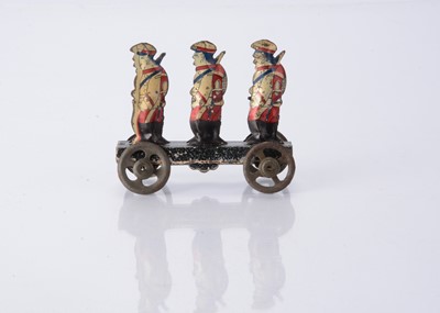 Lot 405 - A Japanese Penny Toy of three marching soldiers