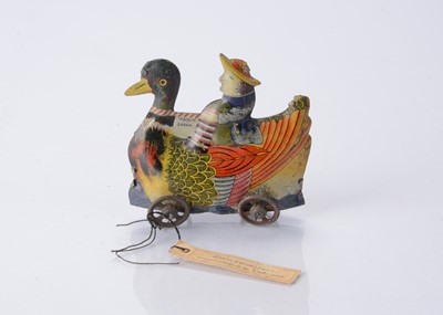 Lot 407 - A Japanese Penny Toy sample of woman riding a duck with card tag