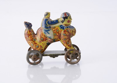 Lot 411 - A Japanese Penny Toy of a boy riding a clown