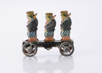 Lot 415 - A Japanese Penny Toy of three sporting hunters