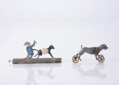 Lot 423 - Two Japanese cast-metal Penny Toys
