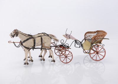 Lot 457 - An 19th century French tinplate open carriage with two horses
