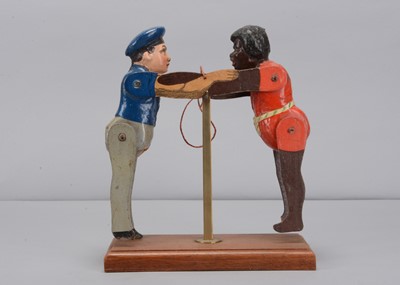Lot 460 - An Albin Amende Sonneberg German navy sailor from the SMS Eber and black man wresting toy, circa 1888