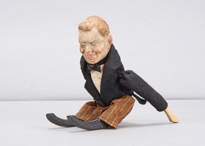 Lot 463 - An early 20th century German composition headed Joseph Chamberlain clockwork tumbling toy