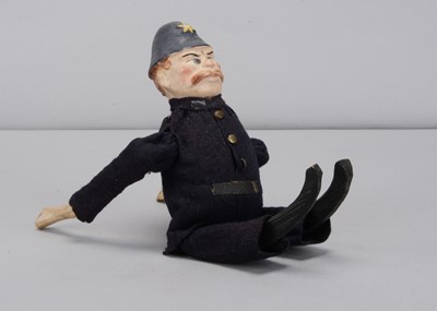 Lot 465 - An early 20th century German composition headed Keystone Cop clockwork tumbling toy