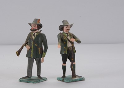 Lot 473 - Two mid to late 19th century German carved wooden huntsmen, probably Erzgebirge