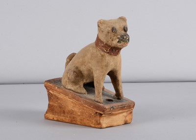 Lot 477 - A mid 19th century Thüringen seated pug dog squeak toy