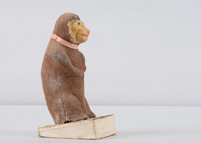 Lot 480 - A late 19th century Thüringen monkey squeak toy