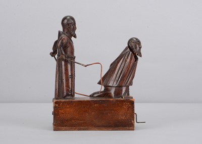 Lot 499 - An 19th century Grödnertal carved wooden hand cranked toy of flagellating monks