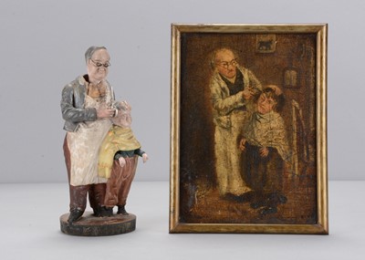 Lot 503 - A mid 19th century Thüringen papier-mâché barber cutting the hair of a boy