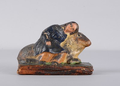 Lot 507 - A mid 19th century Thüringen papier-mâché boy and sheep squeak toy