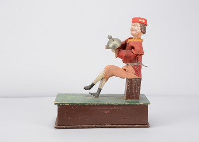 Lot 510 - A mid 19th century Thüringen pull-along boy striking bell
