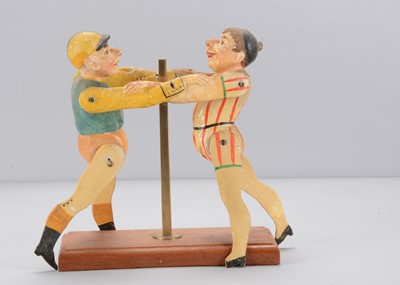 Lot 514 - A late 19th century Albin Amende Sonneberg jockey and clown wrestling toy