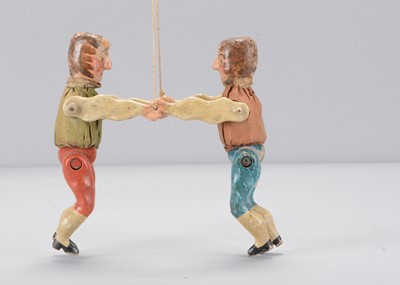 Lot 515 - A mid to late 19th century German wrestling toy