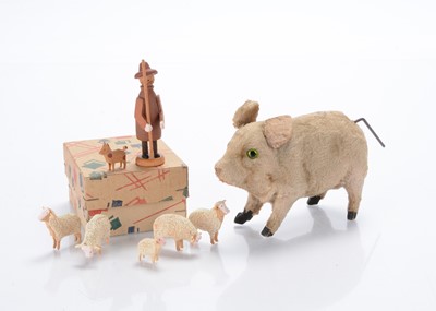 Lot 536 - A clockwork pig and wooden shepherd