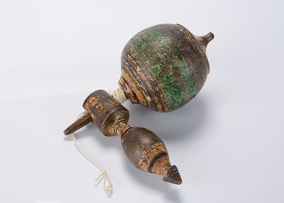 Lot 537 - An early 19th century German turned and painted wooden whistling spinning top