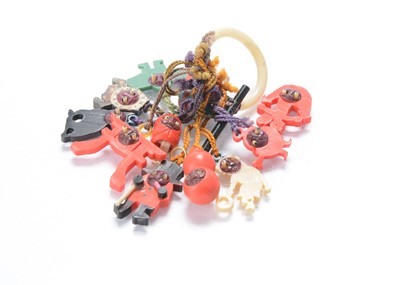 Lot 579 - A Japanese plastic teething ring with twelve plastic Kobi toy charms