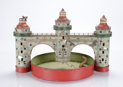 Lot 601 - A German painted tinplate clockwork castle with moat, 1910-20s