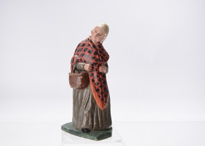 Lot 617 - An unusual 19th German carved wooden figure of a elder woman