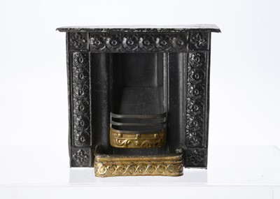 Lot 718 - An 19th century Evans & Cartwright tinplate dolls’ house fireplace