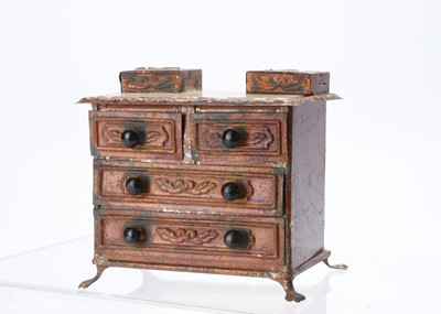 Lot 738 - A rare 19th century Evans & Cartwright tinplate dolls’ house chest of drawers