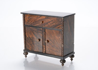 Lot 745 - An 19th century German wood grained dolls’ house cupboard