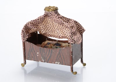 Lot 749 - A 19th century Rock & Graner tinplate dolls’ house canopy bed