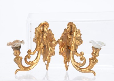 Lot 767 - A pair of German gilt-metal wall lights