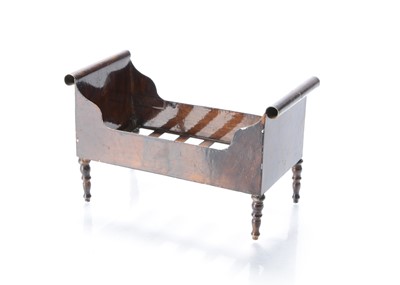 Lot 780 - An 19th century Rock & Graner tinplate dolls’ house sleigh bed