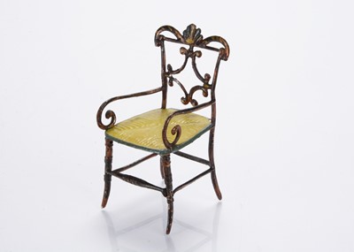 Lot 812 - A mid 19th century pewter dolls’ house ornate chair
