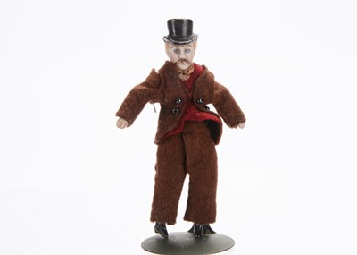 Lot 814 - A late 19th century German bisque shoulder-head dolls’ house doll
