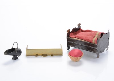 Lot 825 - A late 19th century dolls’ house tinplate doll’s bed