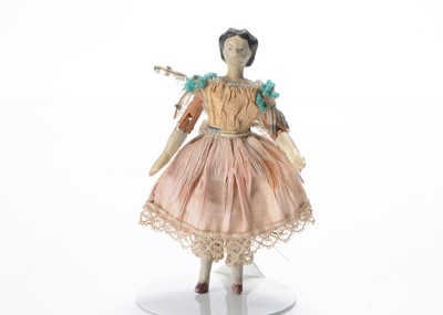 Lot 839 - An 19th century German ‘alien head’ composition dolls’ house doll with jointed wooden body