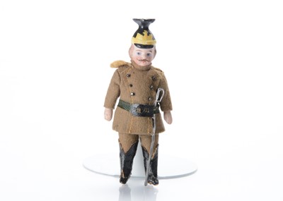Lot 848 - A German all-bisque dolls’ house solider doll