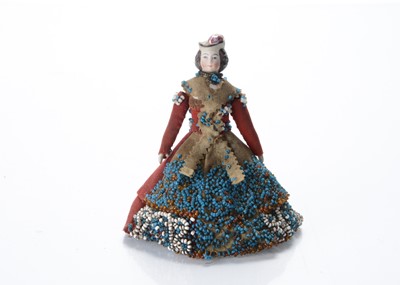 Lot 853 - An 19th century German dolls’ house bisque shoulder-head doll penwipe