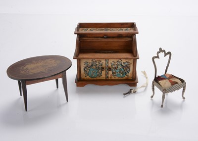 Lot 886 - A wooden dolls’ house roll-top desk money bank