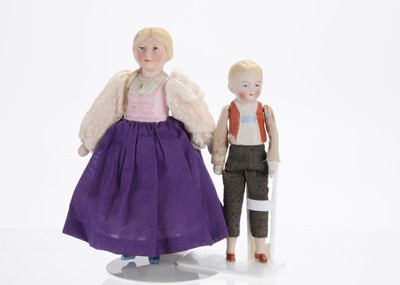 Lot 894 - A Hertwig bisque half-doll girl and boy larger scale dolls’ house doll