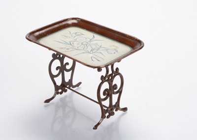 Lot 899 - A German dolls’ house tinplate tea tray on stand