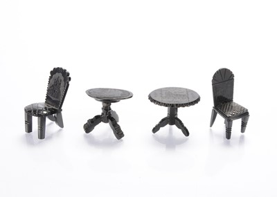 Lot 913 - Four 19th century pieces of Whitby jet dolls’ house furniture