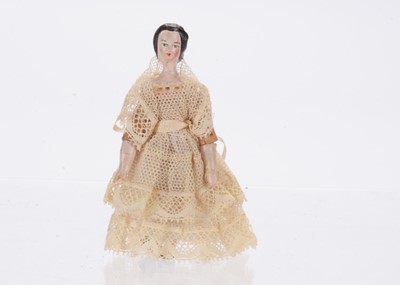 Lot 925 - A mid 19th century German ‘alien head’ dolls’ house doll