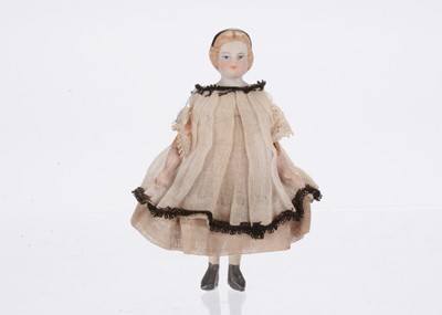 Lot 926 - A mid to late 19th century German bisque shoulder-head dolls’ house doll on jointed wooden body