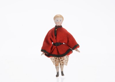 Lot 928 - A mid to late 19th century German bisque shoulder-head dolls’ house boy doll on jointed wooden body